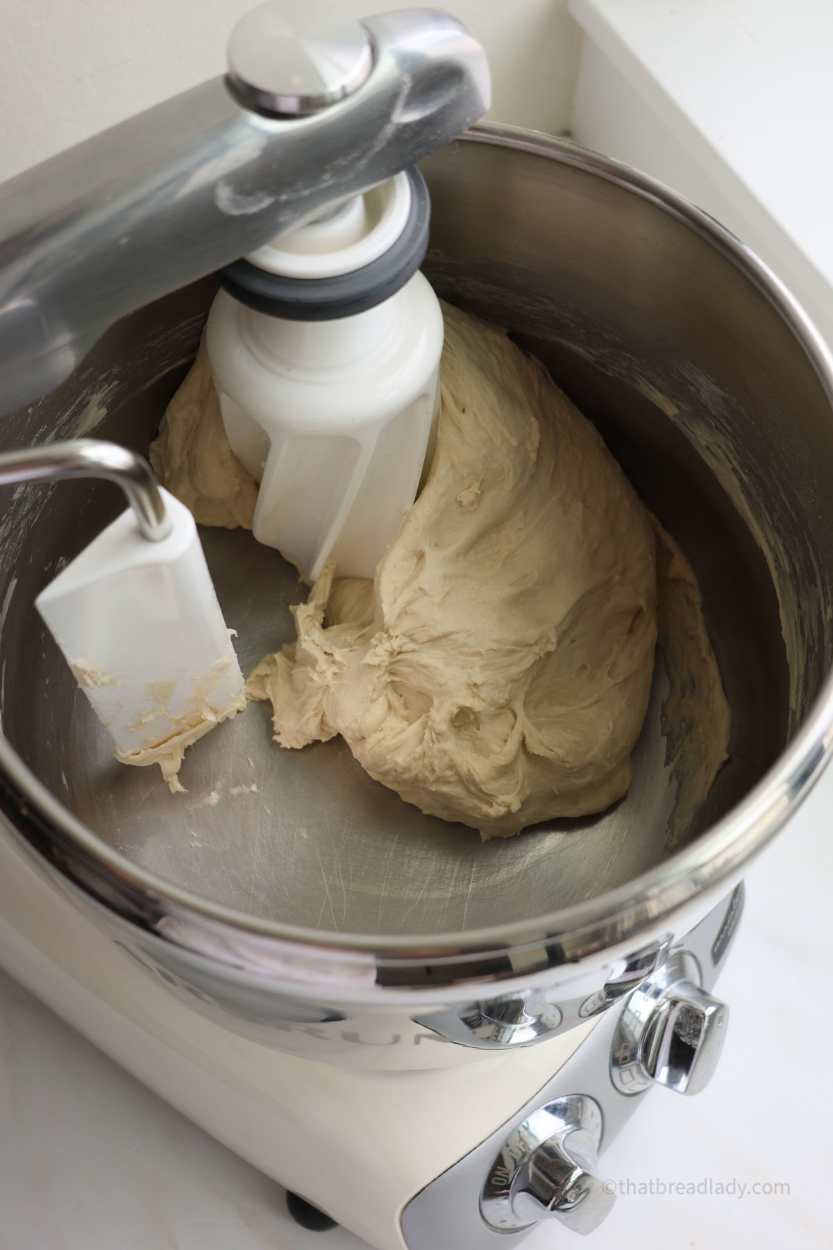 English muffin dough in an Ankarsrum mixer, all one one smooth mass.