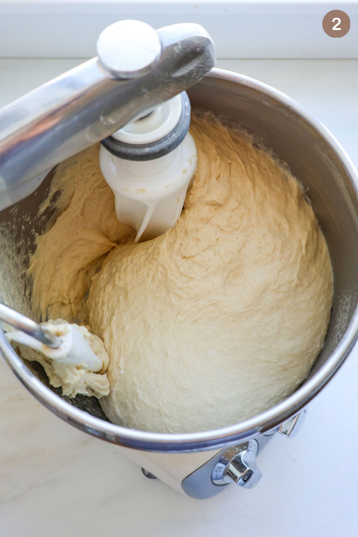 Cinnamon roll dough in a mixer.