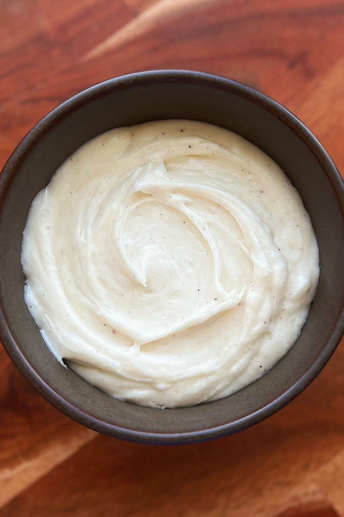 A bowl of brown butter cream cheese frosting.