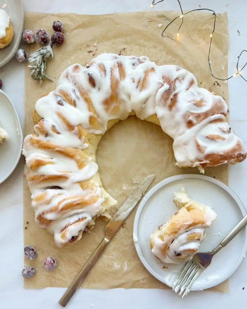 Sugared cranberries garnishing a Cinnamon Roll wreath.