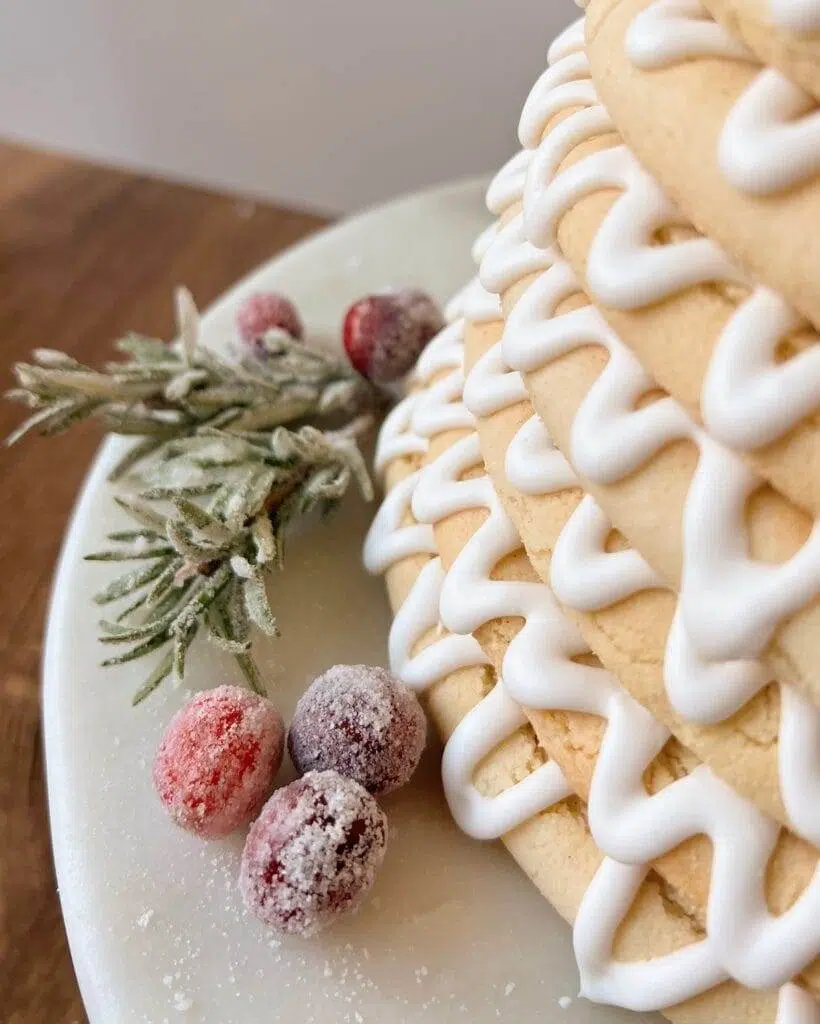 Kransekake garnished with sugared cranberries.