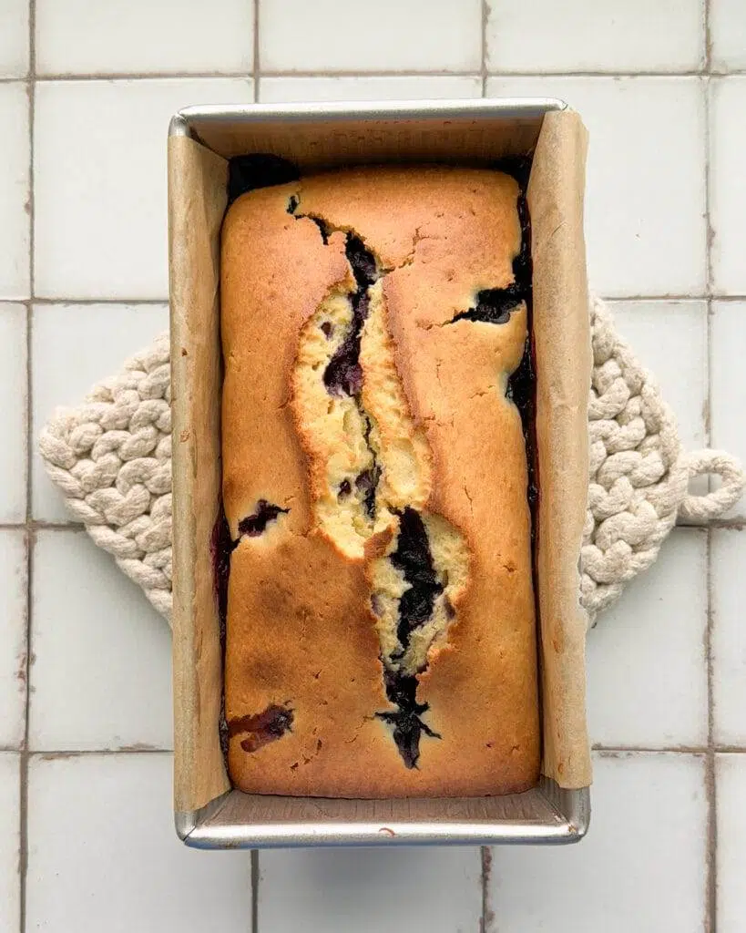 Lemon blueberry loaf in a bread pan.