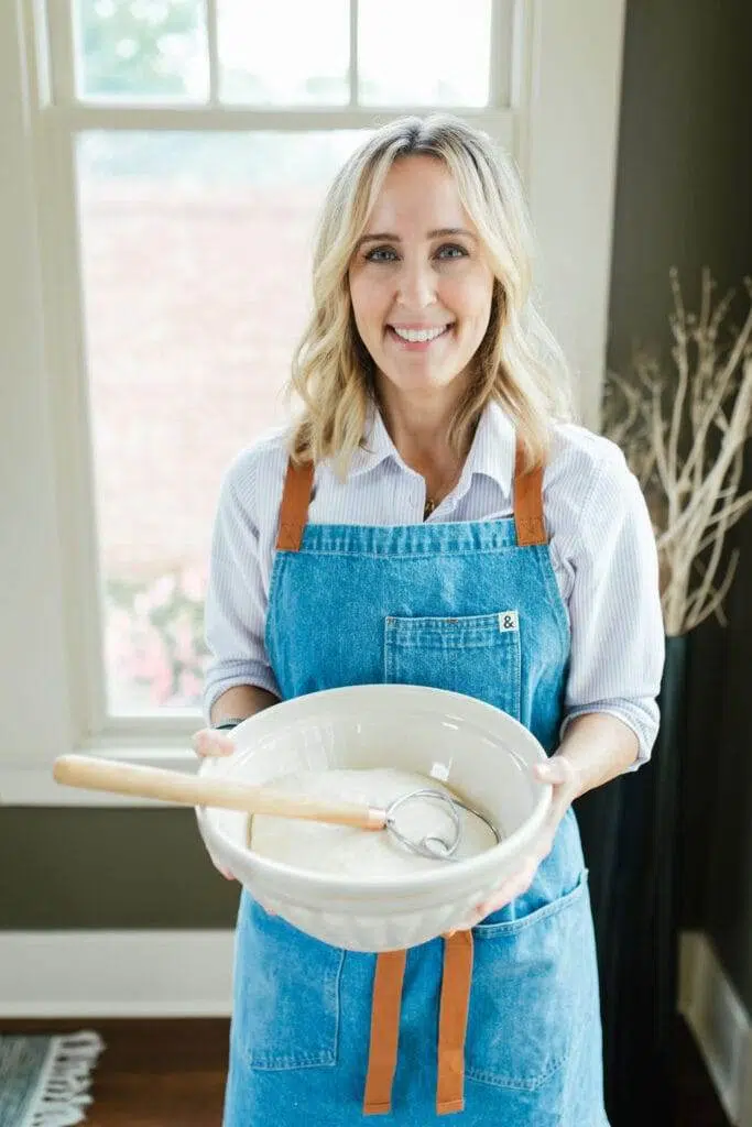 That Bread Lady, Heather Thomas, holding a bowl of dough.