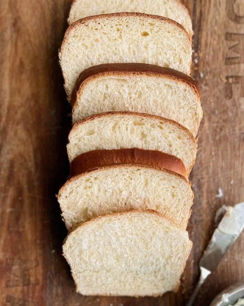 Sliced bread on a board with a titile that says Bread Recipes.