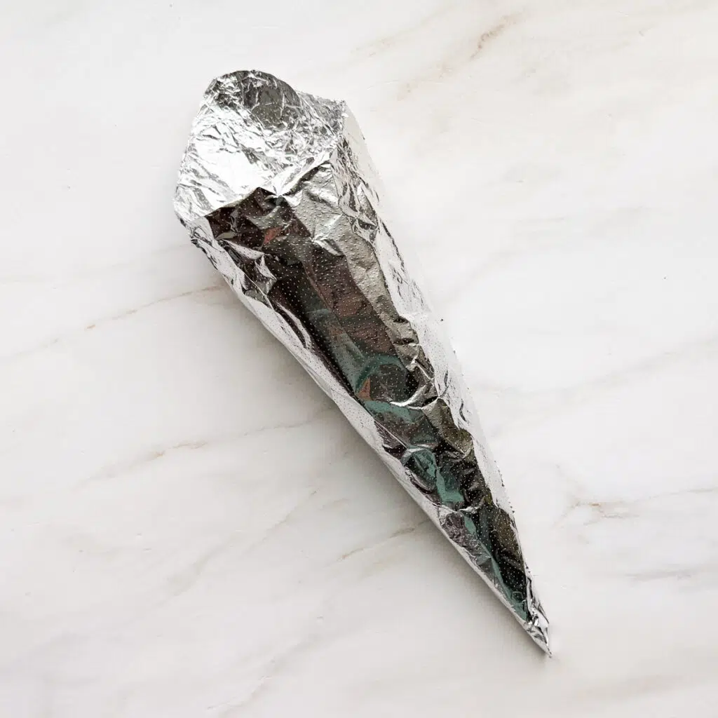 A cone mold in aluminum foil.