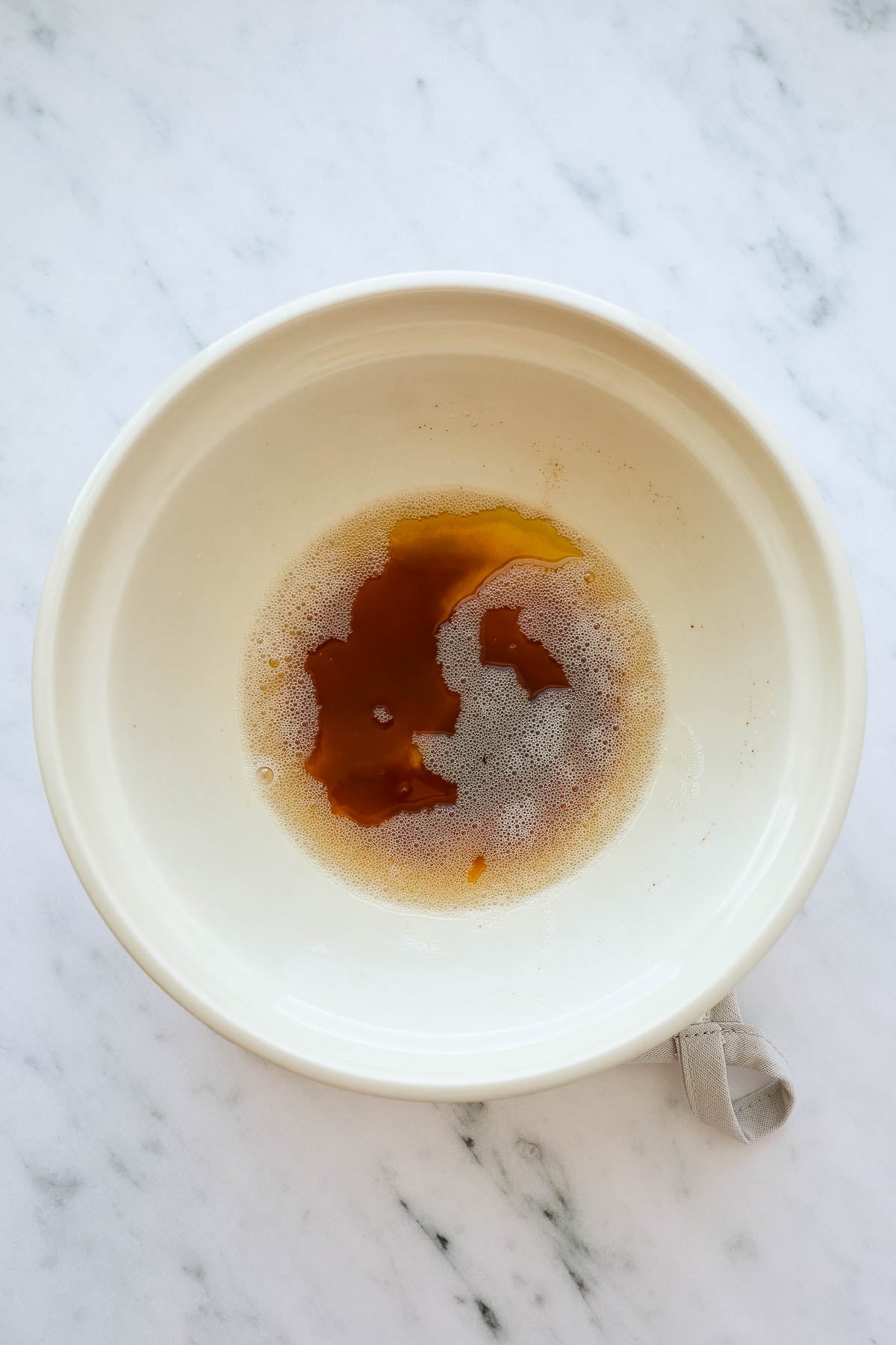 A bowl with melted browned butter.