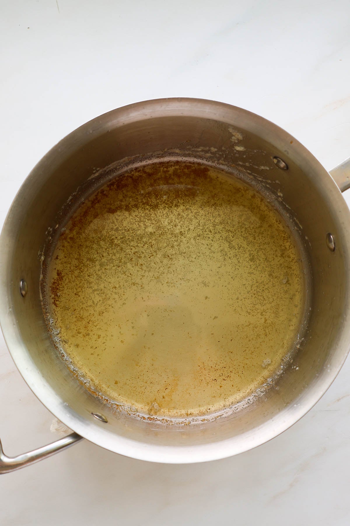 Melted browned butter in a saucepan.