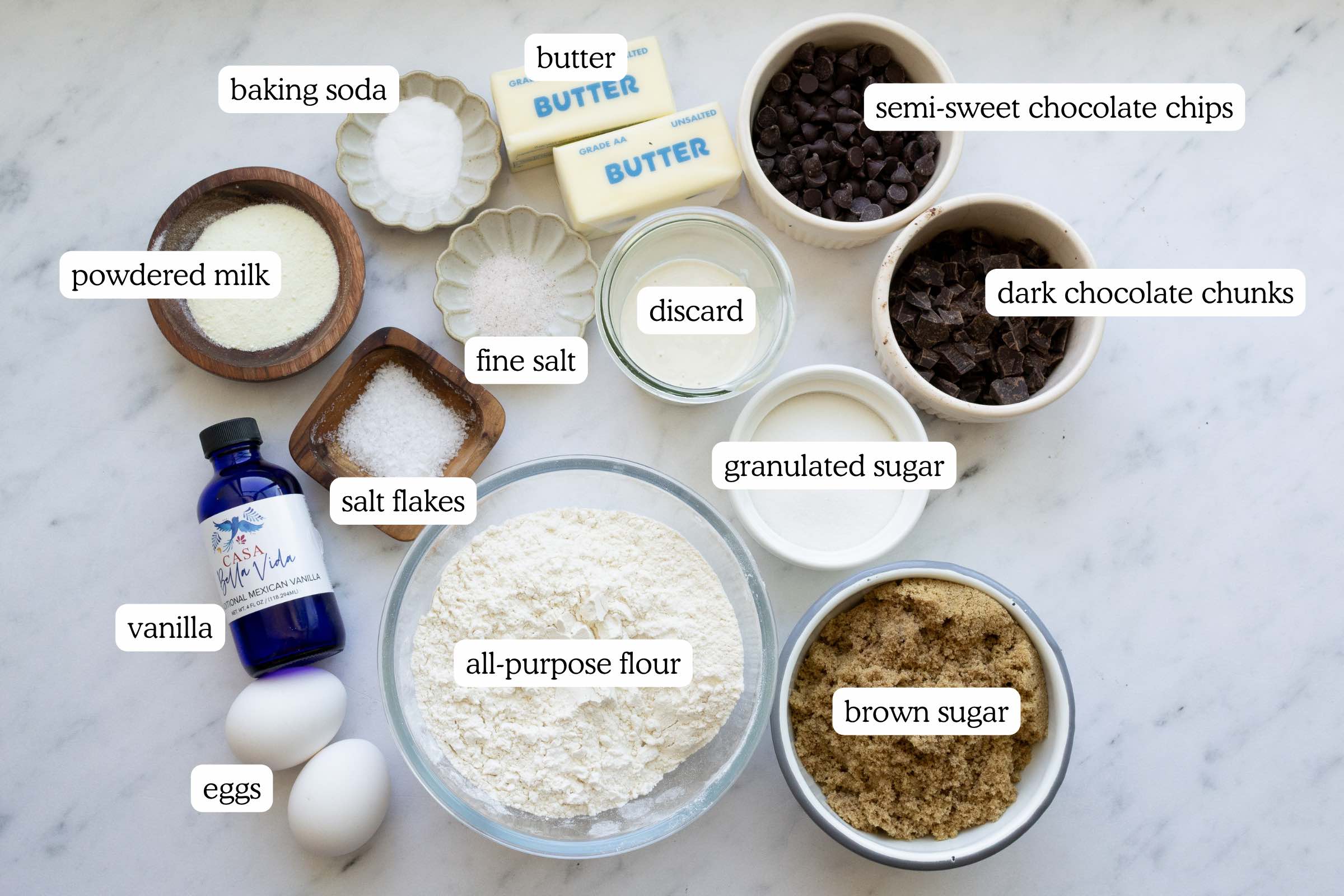 All the ingredients for brown butter sourdough chocolate chip cookies, measured in their own containers.