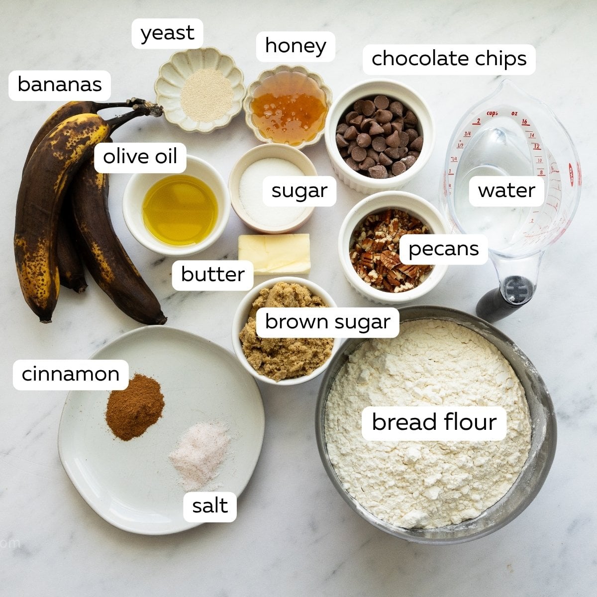The ingredients for chocolate chip banana bread focaccia, measured out and in their own bowls.